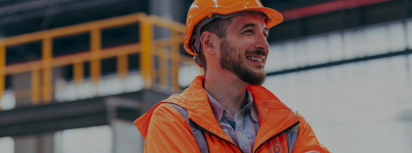 A site worker in hi-vis and hard hat